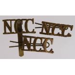 Badges: NCC - Non-Combatant Corps WW1 & 2 Cap badge and shoulder title pair (KK2163 & Westlake 394).