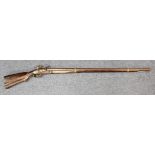 18th century flint lock musket with caved stock, brass furniture unusual gun.