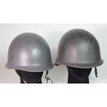 USA MI pattern steel helmets two of complete with linings.