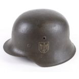 German steel Helmet a raw edge Whermacht single decal with liner, minor corrosion to fittings.