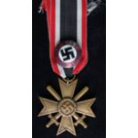 German War Merit Cross with swords, maker stamped ring, plus a Party lapel badge