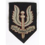 Badge an SAS larger early size beret badge, service worn.