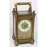 Brass five glass carriage clock, enamel dial with Arabic numerals, surrounded by foliage filigree