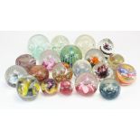 Twenty glass paperweights, makers include Caithness, Langham Glass, etc.