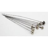 Hat Pins. Eight silver & white metal hat pins, longest 23.5cm approx.