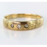 Yellow metal stamped 585 three stone Diamond Ring 2.9g