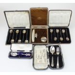 Mixed lot of boxed silver comprising two sets of six bean topped coffee spoons, a child's spoon &