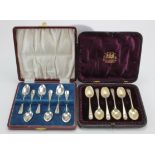 Two sets of six silver hallmarked teaspoons, contained in fitted cases, together with a silver