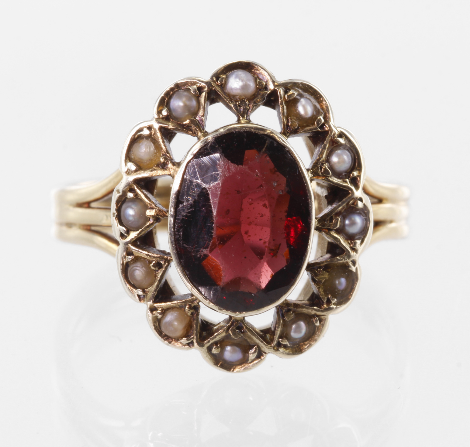 Yellow metal (tests 15ct) Garnet and Seed Pearl Ring size K weight 3.6g