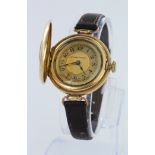 Gold plated mid-size half hunter wristwatch by Stewart Dawsons, working when catalogued