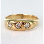 Yellow metal (tests 14ct) three stone Diamond Gypsy style Ring size J weight 2.8g