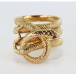 Yellow metal (tests as 18ct gold) Snake Ring with Ruby eyes size J weigh 10.2g