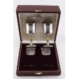 Pair of silver goblets, by Garrard & Co. celebrating the Queens Silver Jubilee, with gilt lion