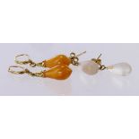 Two pairs of 9ct Gold Earrings both drop style and set with Glass and Amber weight 6.2g