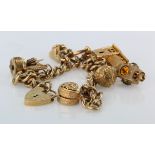 9ct / Yellow metal charm bracelet with a good mixture of charms attached. Total weight 76.4g