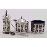 Three piece silver Open-work cruet set with three glass liners (two blue glass and one green .one of