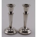 Pair of silver Dwarf Candlesticks - hallmarked S&M, Birm. 1974, Height of both 11cm approx.