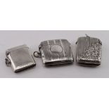 Three silver vesta cases, various hallmarks.