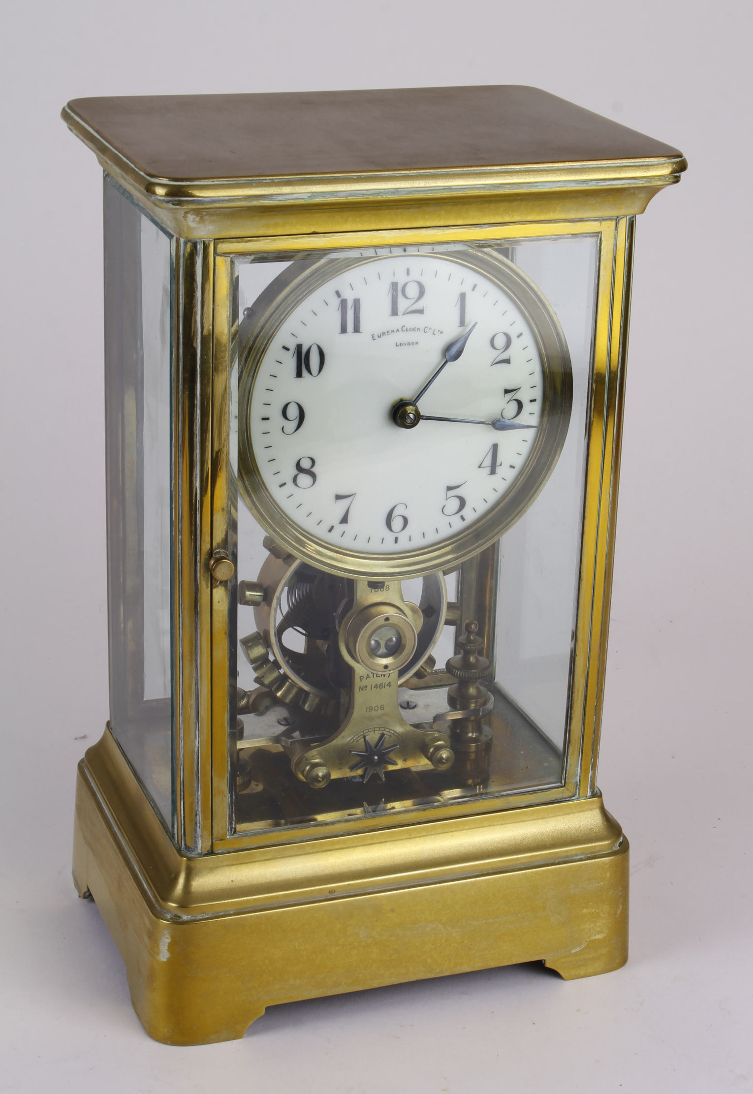 Eureka Clock Co. Ltd brass four glass mantel clock, Arabic numerals to dial, engraved with nos. 'no.