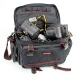 Photography equipment. A group of photography equipment, including two cased cameras (Nikon EM &