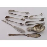 Mixed lot of silver flatware comprises four pairs of sugar tongs, two butter knives and a modern