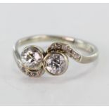 White metal (tests 14ct) Ring set with two central Diamonds with Diamond shoulders approx 1.00 ct wt