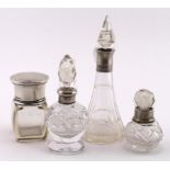 Three silver mounted glass perfume bottles (various hallmarks), large one is chipped on base plus