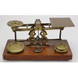 Sampson Mordan & Co. brass postal scales, with a selection of weights, height 12.5cm, length 26.