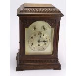 Large Victorian oak mantel clock, silvered dial with Arabic numerals, two subsidiary dials, movement