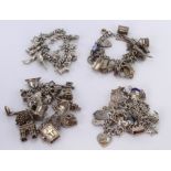 Three Silver / white metal charm bracelets all with a good variety of charms attached. Total