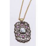 9ct Gold stamped Aquamarine and Ruby Pendant on a 16 inch fine chain weight 6.2g