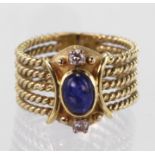 Yellow Gold Ring stamped 18ct set with cabochon Sapphire and small Diamonds size N weight 7.7g