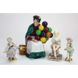 Four figures, comprising Royal Doulton 'Old Balloon Seller HN1315'; Royal Crown Derby 'Sunshine', by