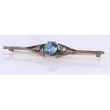 Yellow metal Bar Brooch (tests 9ct) set with Aquamarine and Diamond weight 7.2g