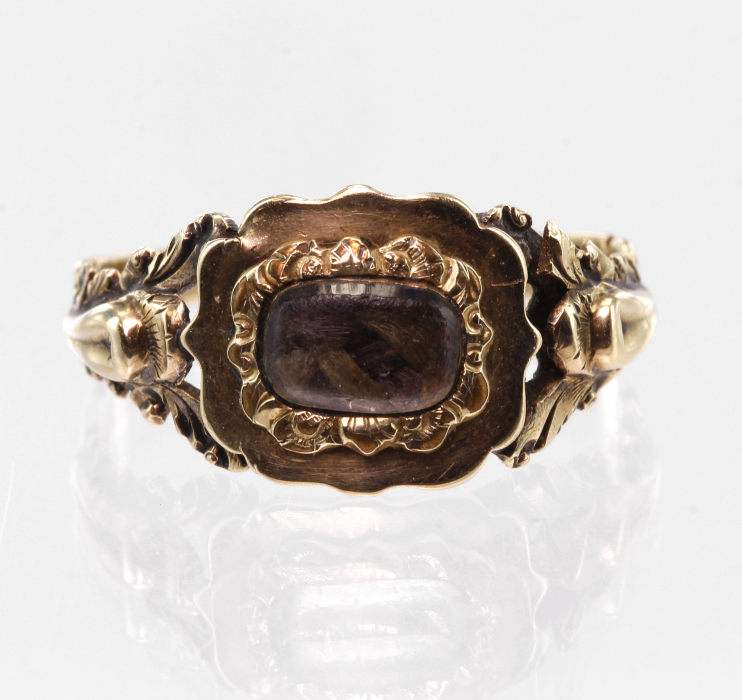 Yellow metal tests 9ct Georgian style Mourning Ring with hair set panel weight 1.7g size L