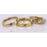 Three Yellow Metal Rings : Three stone Diamond (tests 15ct, 5.1g) Wedding band (tests 14ct,2.5g)