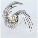 White metal (tests as 18ct) spiral brooch with central Pearl. Total weight 14.1g