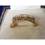 Jewellery, an 18ct yellow gold ring set with 5 graduated diamonds hallmarked Birmingham 1975 (