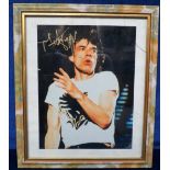 Music memorabilia, Rolling Stones, framed print showing Mick Jagger, signed in gold marker, frame