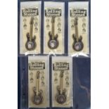 Music memorabilia, The Rolling Stones, set of 5 plastic Rolling Stones Guitar Brooches, all on cards