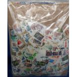 Stamps, GB kiloware. 5 bags of on and off paper commemorative and definitive stamps including high