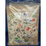 Stamps, GB kiloware. 5 bags of on and off paper commemorative and definitive stamps including high