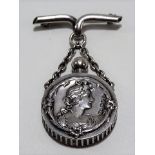 Good Edwardian Art Nouveau silver scent bottle with pin and suspension chain, the circular scent