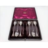Victorian silver cased set of six demi-tasse spoons with shell bowls and a pair of sugar tongs,