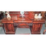 Good early Victorian flame mahogany break front Credenza, the raised back with leaf scroll supports,