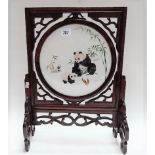 20th Century Chinese hardwood table screen with revolving finely embroidered glazed centre panel,