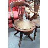 Early 20th Century oak swivel desk chair with four outswept legs with ceramic castors