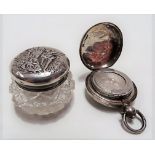 George V silver lid cut glass miniature ovoid jar, the lid embossed with a romantic scene,