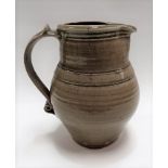 Leach St Ives Pottery standard ware celadon glazed jug with circular pottery seal, height 19.5cm.