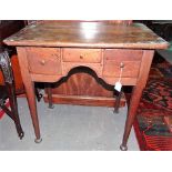 18th Century oak lowboy, the top with re-entrant corners, the kneehole shaped frieze with three